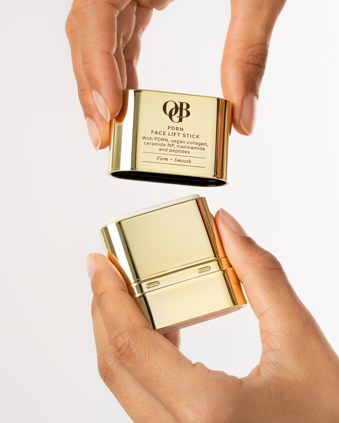 OGB Hydrate & Lift Duo: hands opening the gold face lift stick